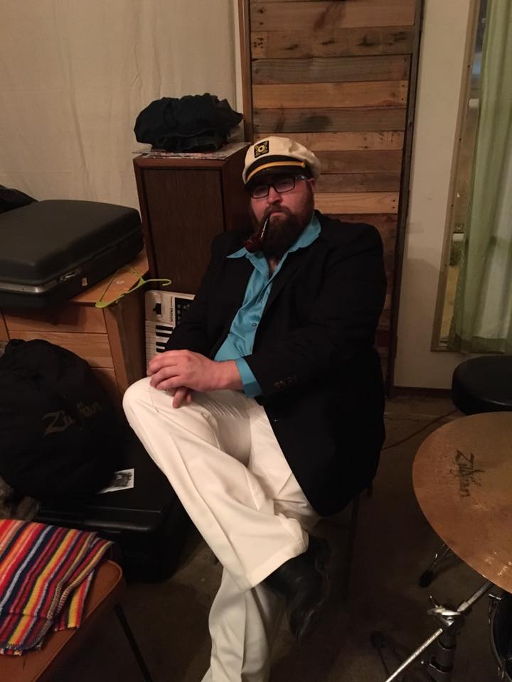 lealan carter in 1980s cruise captain attire